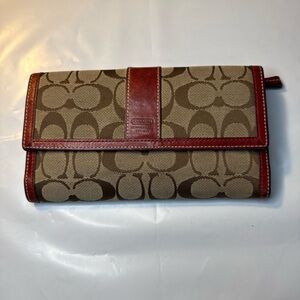 COACH Brown and Tan “C” logo Long Wallet with Burgundy leather trim.